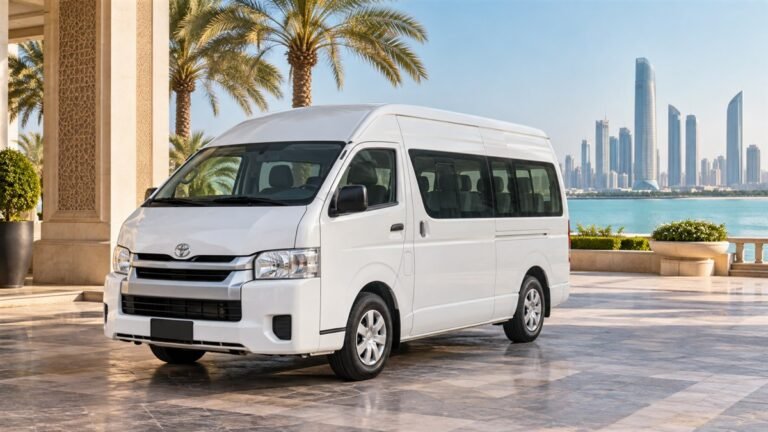 12 seater van rental Abu Dhabi – illustration of a white Toyota Hiace beside a waterfront hotel
