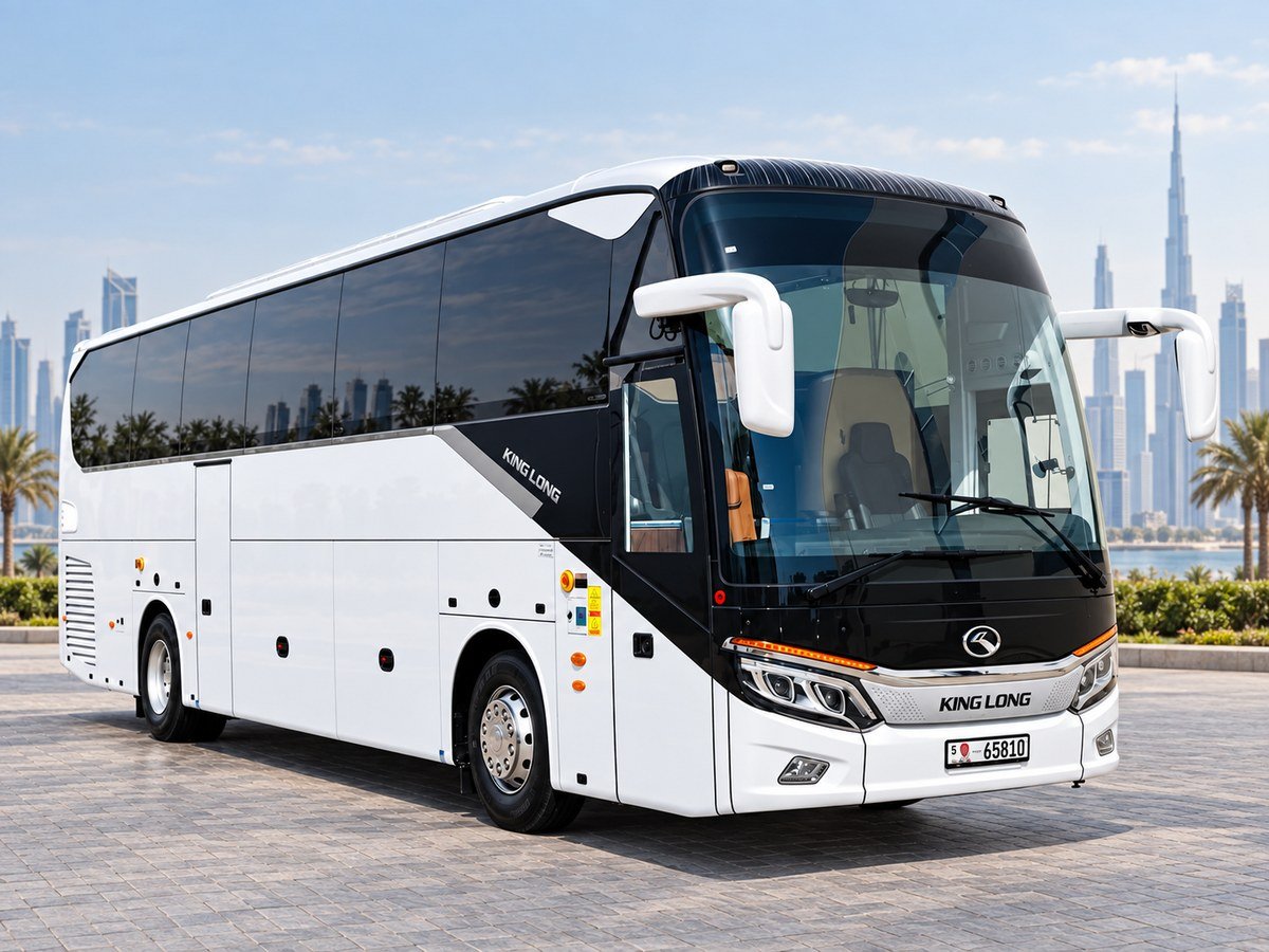White and black King Long coach with the Dubai skyline in the background